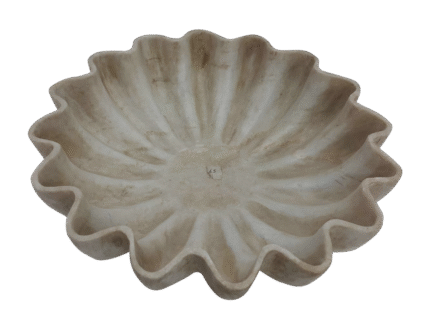 Decorative beige fluted ceramic bowl on display