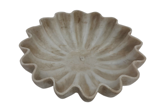 Decorative beige fluted ceramic bowl on display