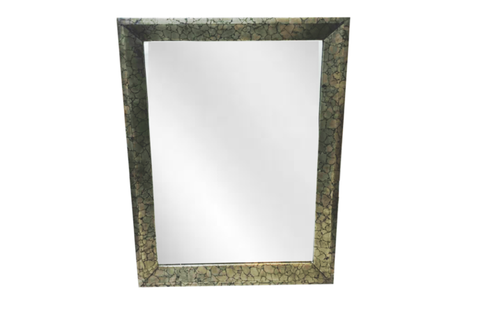 Antique rectangular mirror with ornate frame.