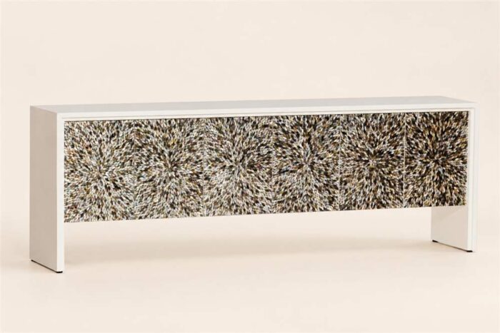 Long white MOP inlay cabinet with a multicolour starburst-patterned front
