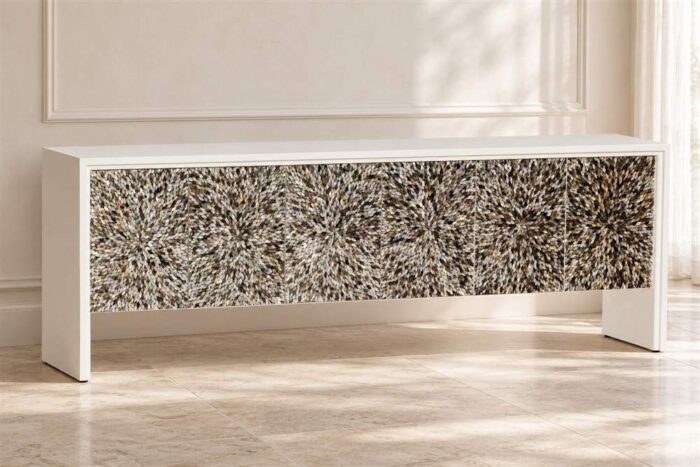 Long white MOP inlay cabinet with starburst-patterned front in a bright neutral interior