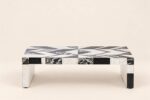 Rectangular black-and-white stone inlay coffee table with geometric top and block legs