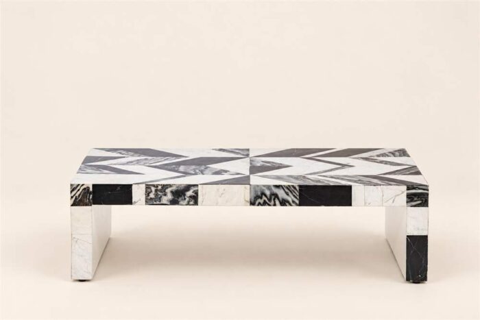 Rectangular black-and-white stone inlay coffee table with geometric top and block legs