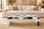 Black-and-white stone inlay coffee table in front of a cream sofa in a warm living room